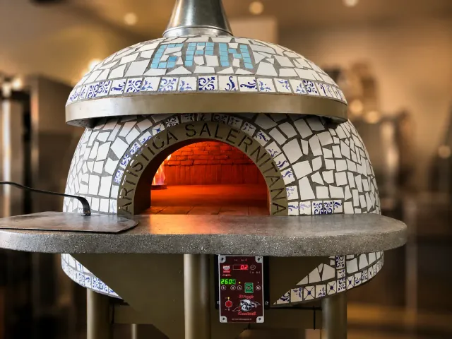 The wood-fired Neapolitan pizza oven at Leo’s Beach Bar